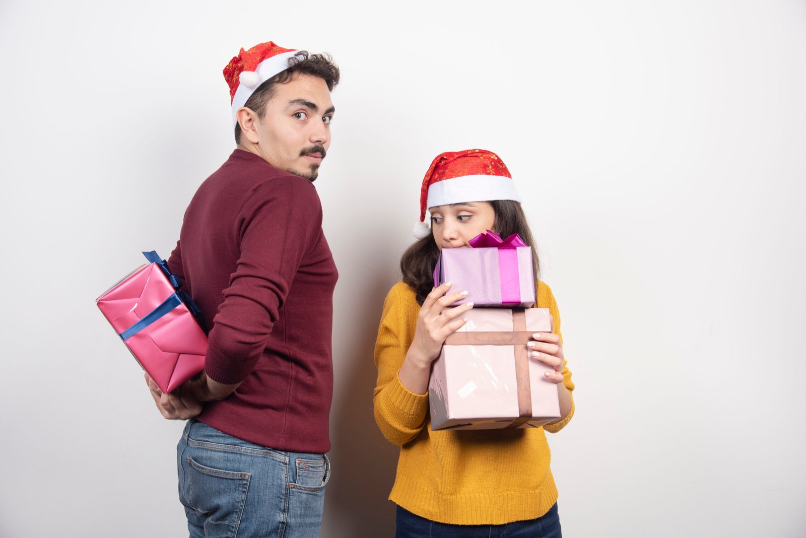 Man and woman posing with Christmas presents. High quality photo